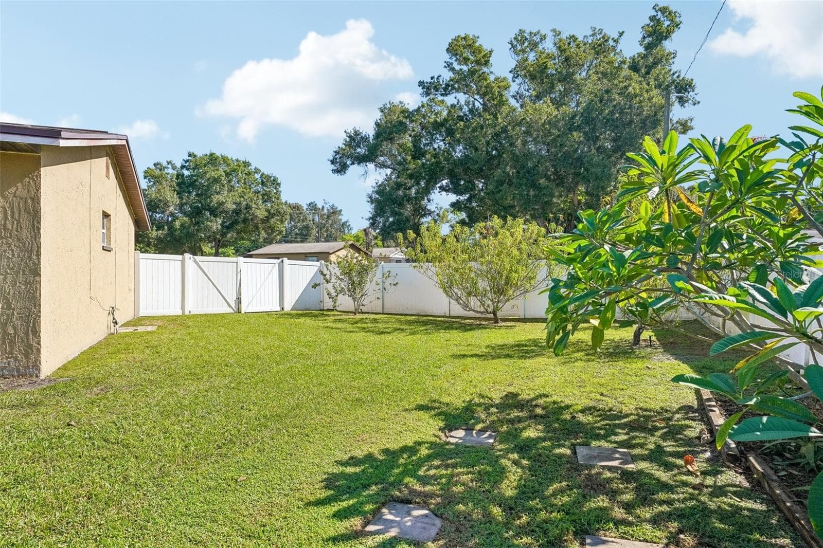 Perfect for RV or boat enthusiasts! The property features a convenient double-wide entry gate, offering easy access and the added benefit of storing your RV or boat right on your own property—eliminating the hassle and expense of off-site storage while keeping your recreational vehicles close by and ready for your next adventure! - 4100 45TH AVE N, ST PETERSBURG