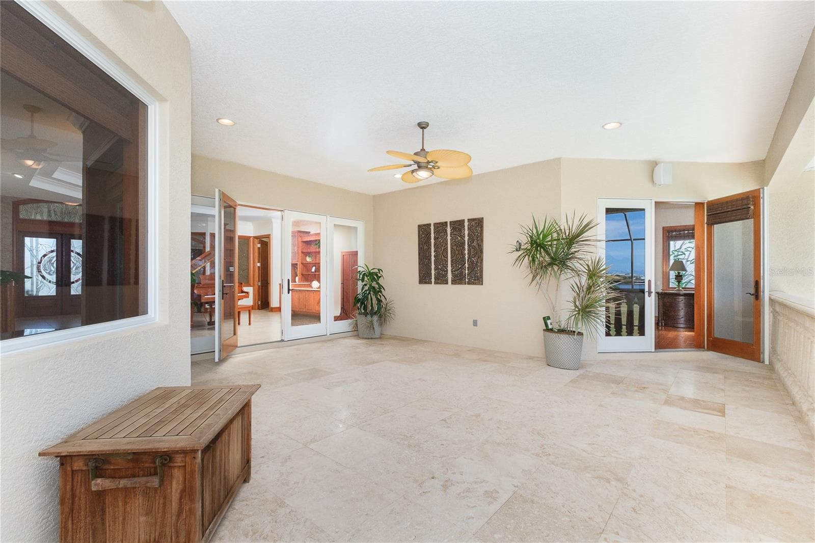 Living Room extends to a travertine balcony overlooking Lemon Bay - 1930 BAYSHORE DR, ENGLEWOOD
