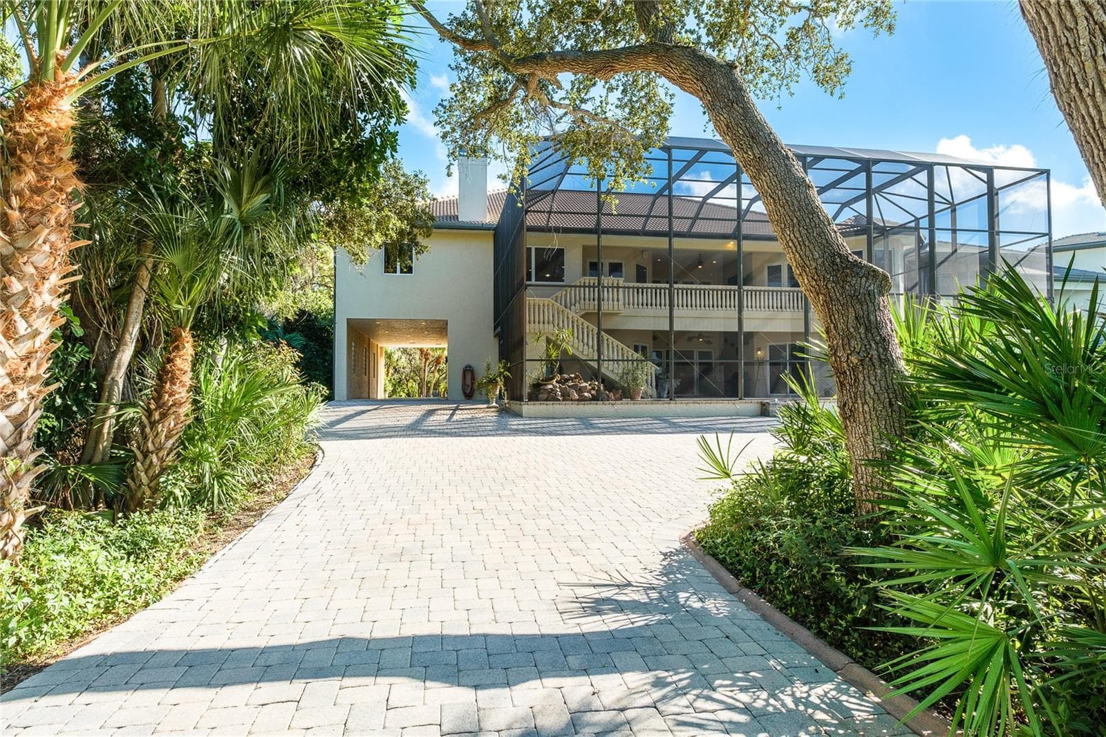 2 car tandem parking area extends out to an expansive paver area - 1930 BAYSHORE DR, ENGLEWOOD