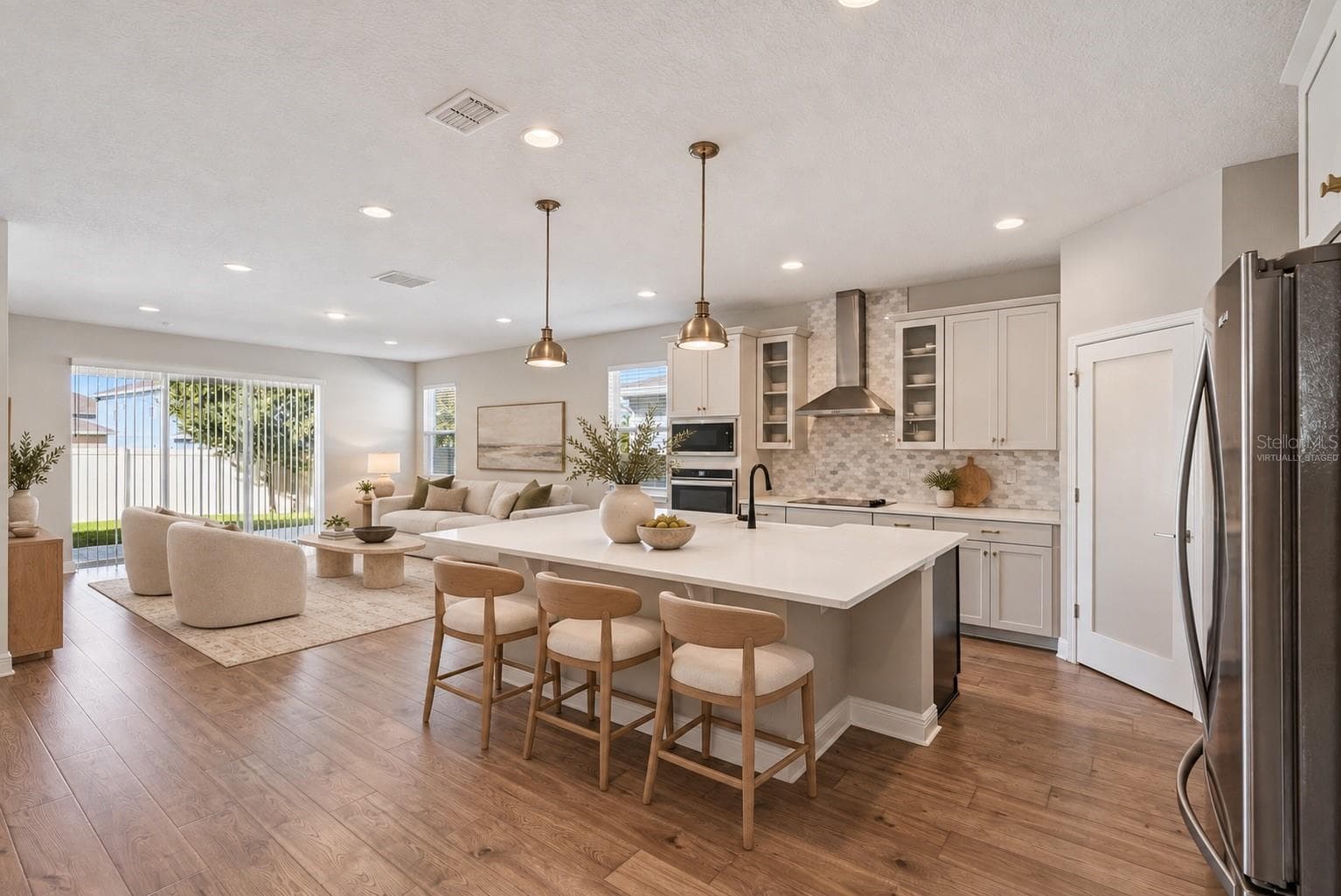 Virtually Staged Kitchen and Family Room - 4417 LIONS GATE AVE, CLERMONT