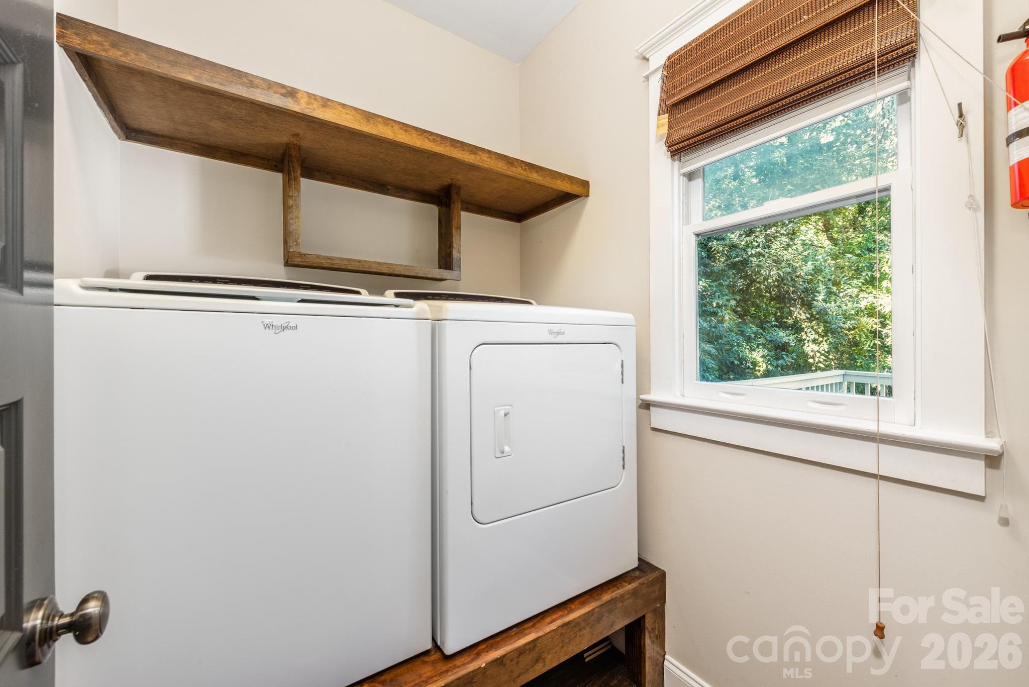 Main level laundry room off of the kitchen - 3315 Holt Street, Charlotte