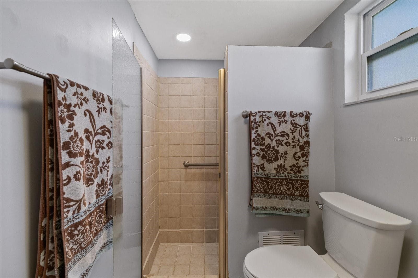 Primary bathroom with walk in shower - 8710 ARROWHEAD DR, HUDSON