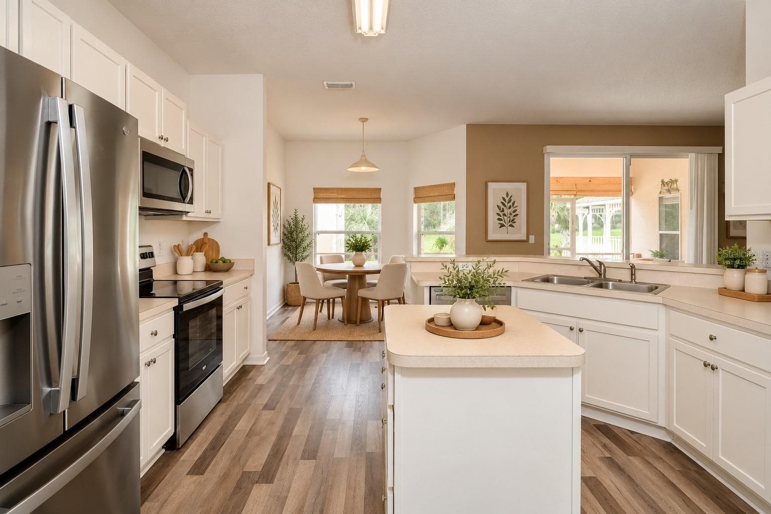 Virtually Staged Kitchen overlooking Breakfast Nook - 46 LLAMA TRL, PALM COAST