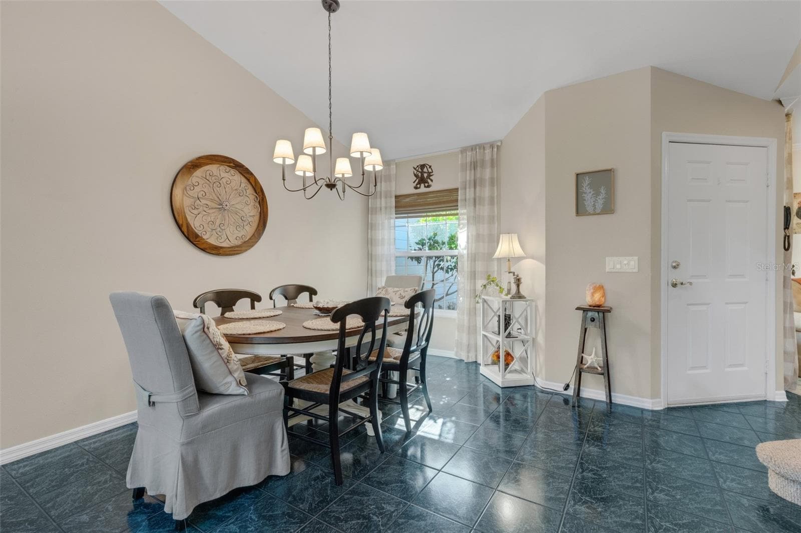 Step inside to the spacious dining & living room combo space decked out in easy care tile flooring. - 1113 WATERFALL LN, LAKELAND