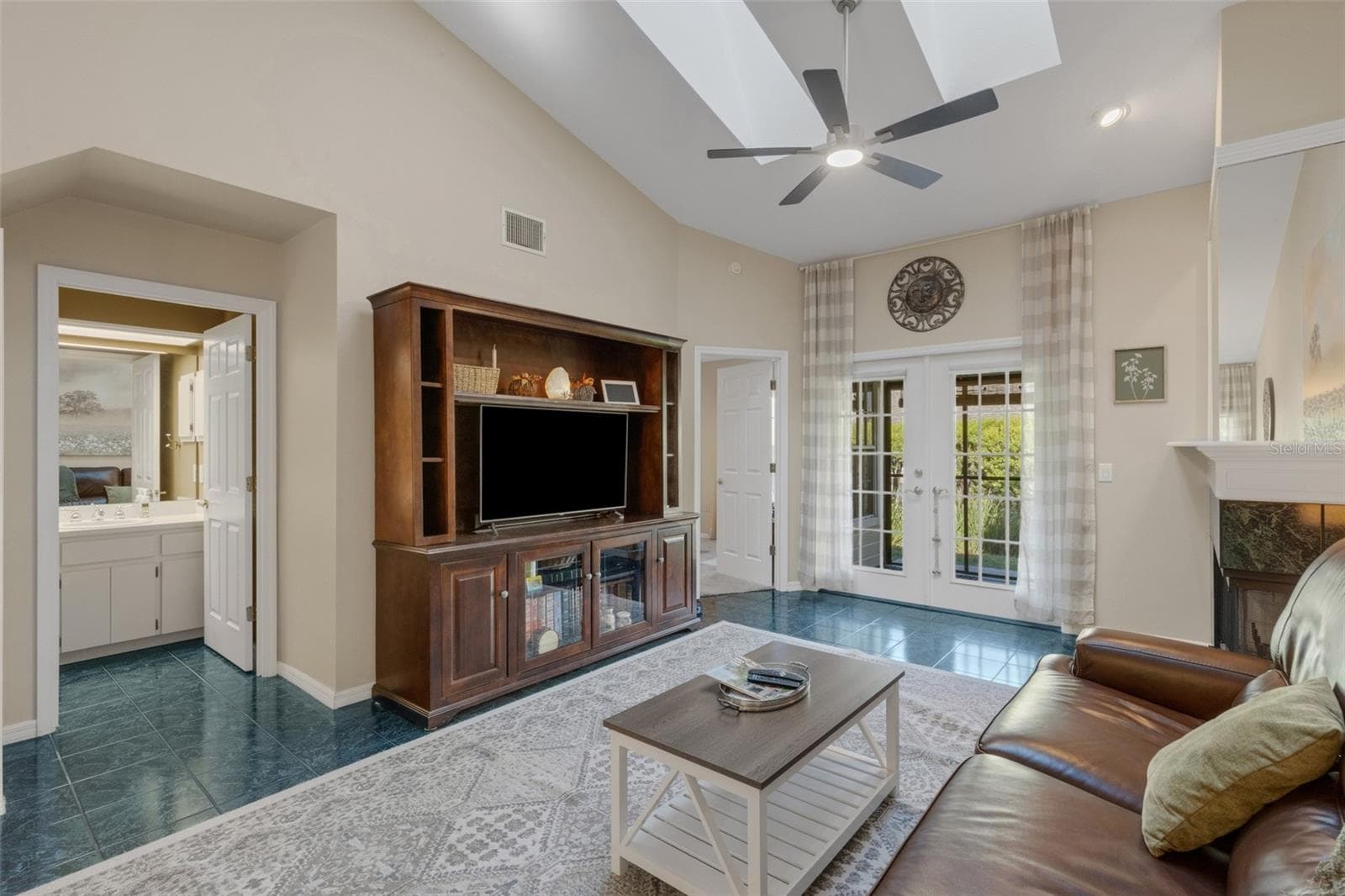French doors lead to the covered screen enclosed lanai. - 1113 WATERFALL LN, LAKELAND