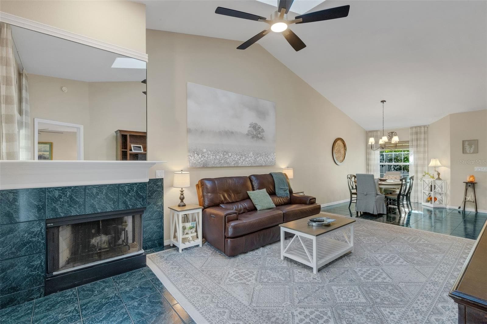 The wood burning corner fireplace is a nice touch when the weather is mild. - 1113 WATERFALL LN, LAKELAND