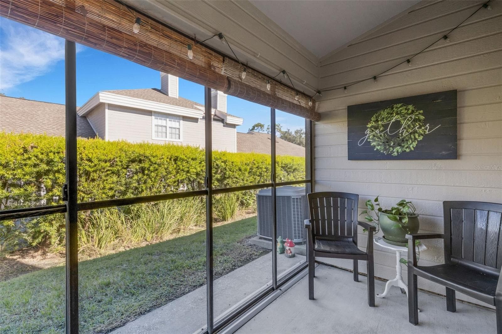 Downstairs the covered screen enclosed lanai opens to the greenbelt area beyond. - 1113 WATERFALL LN, LAKELAND