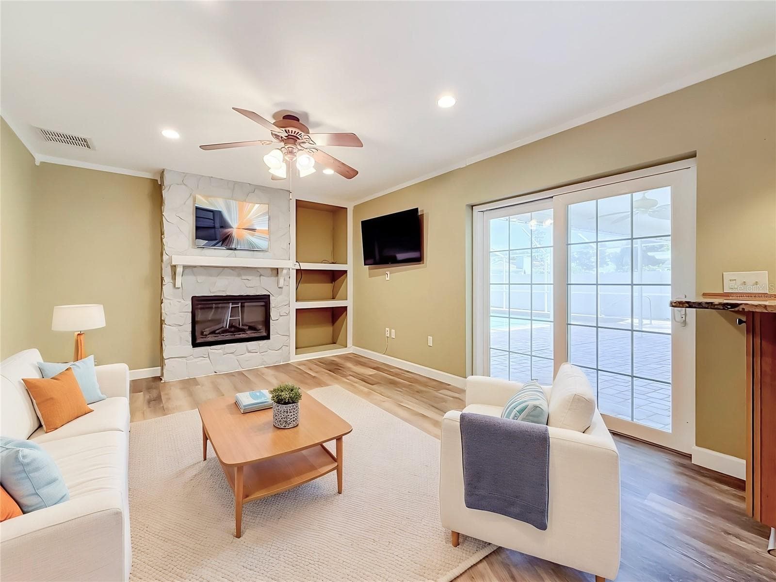 Virtually staged family rm - 3120 SWAN LN, SAFETY HARBOR