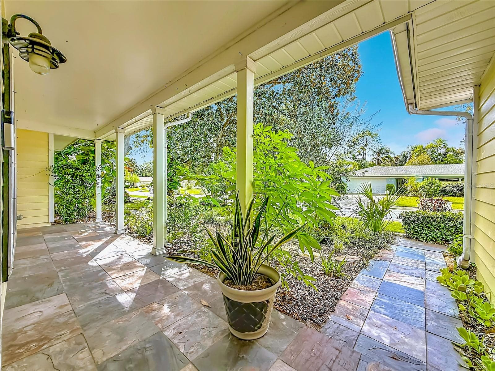 Covered front porch w/ slate tiles - 3120 SWAN LN, SAFETY HARBOR