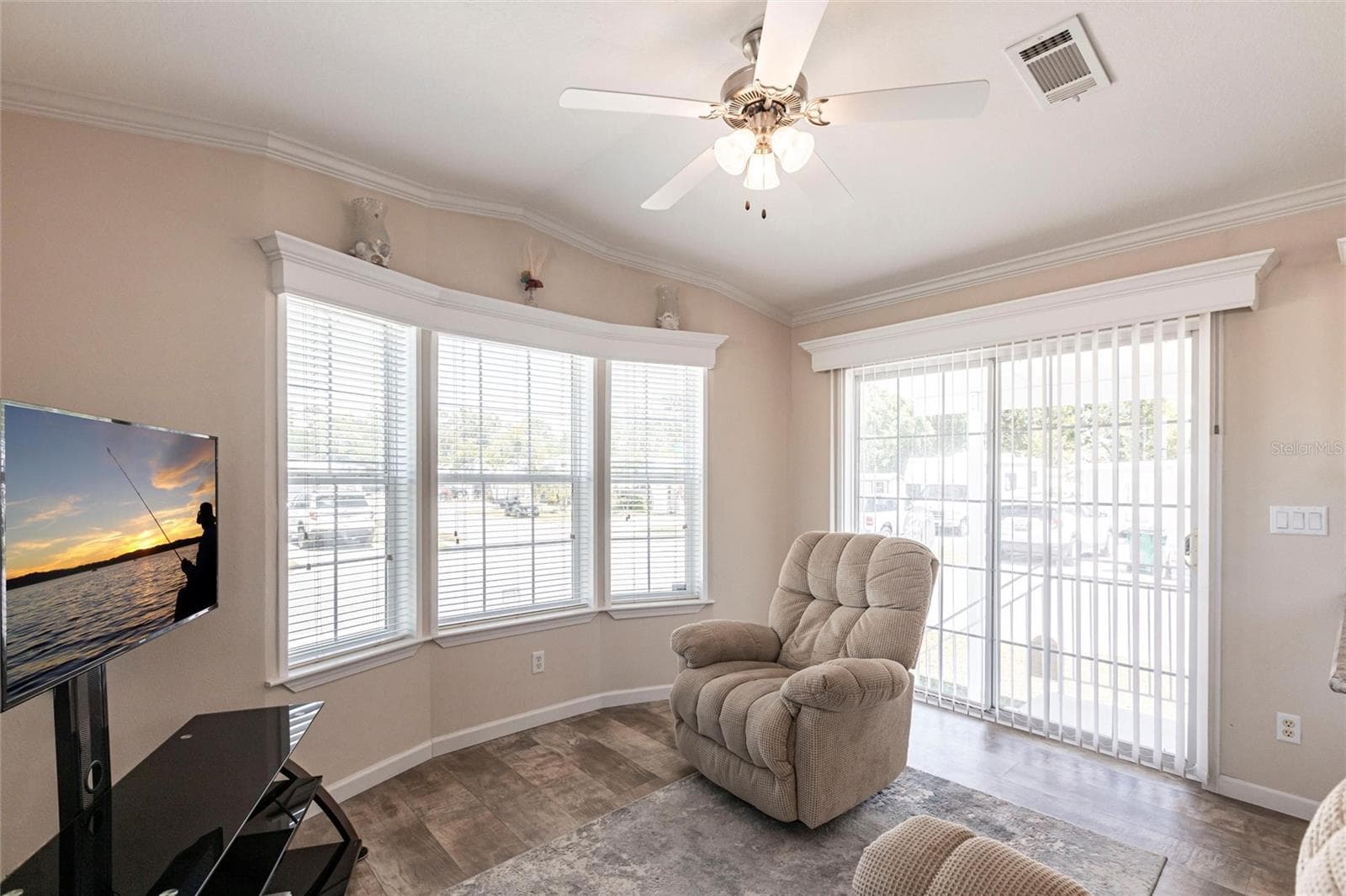 Living area and sliding door to covered patio - 1329 TROUT, PUNTA GORDA