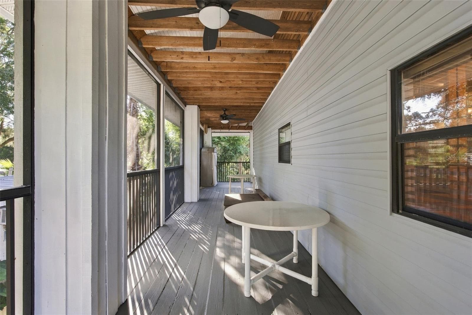 Main Floor Wrap Around Porch - 14317 GUAVA ST, HUDSON