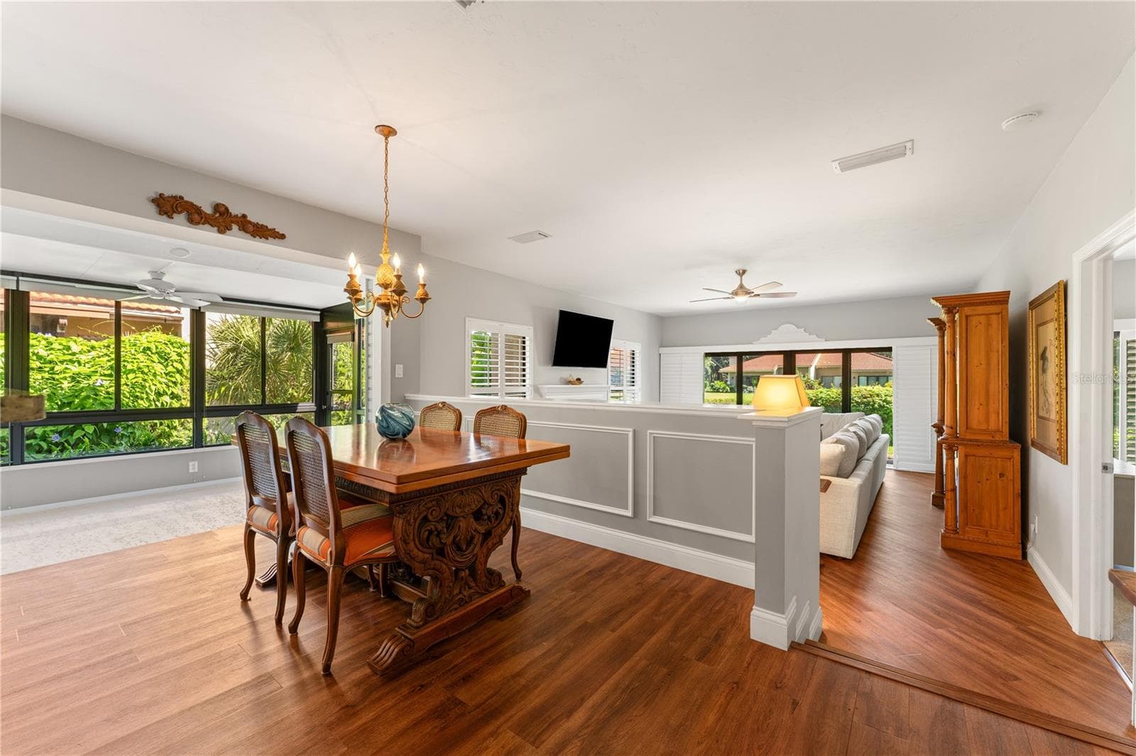 Formal dining room featuring open sightlines and natural light. - 1720 KESTRAL PARK WAY S #49, SARASOTA
