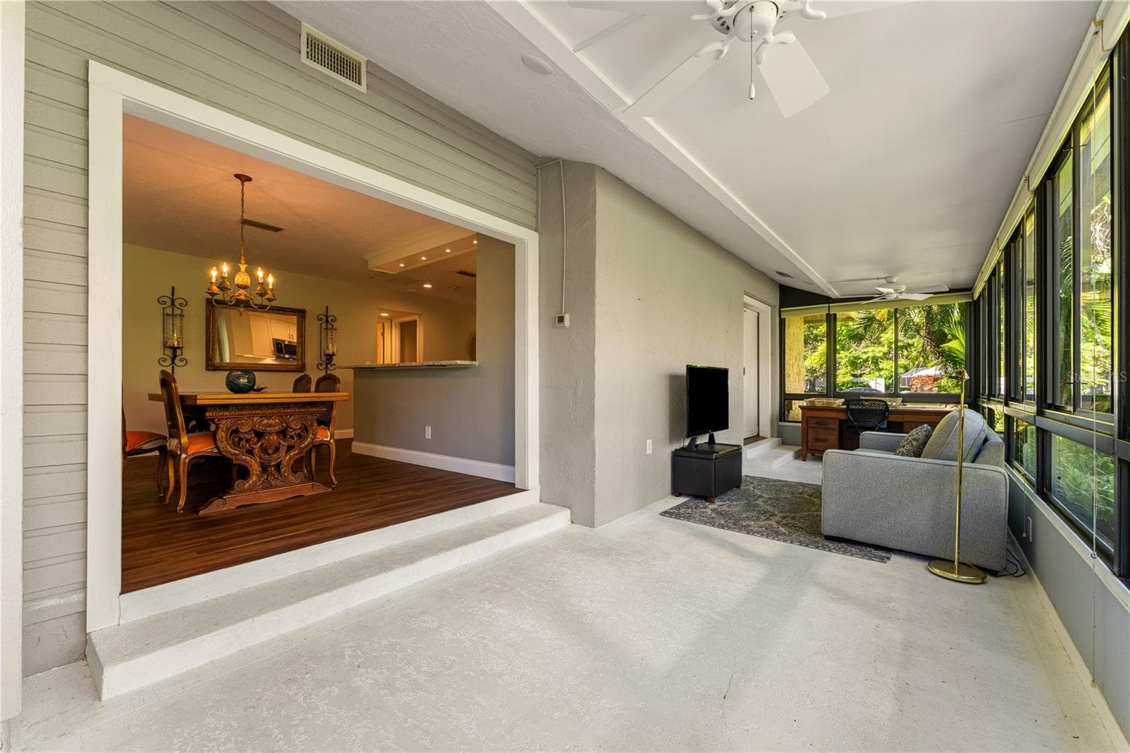 Climate-controlled sunroom with dedicated zoned AC system and lake views. - 1720 KESTRAL PARK WAY S #49, SARASOTA