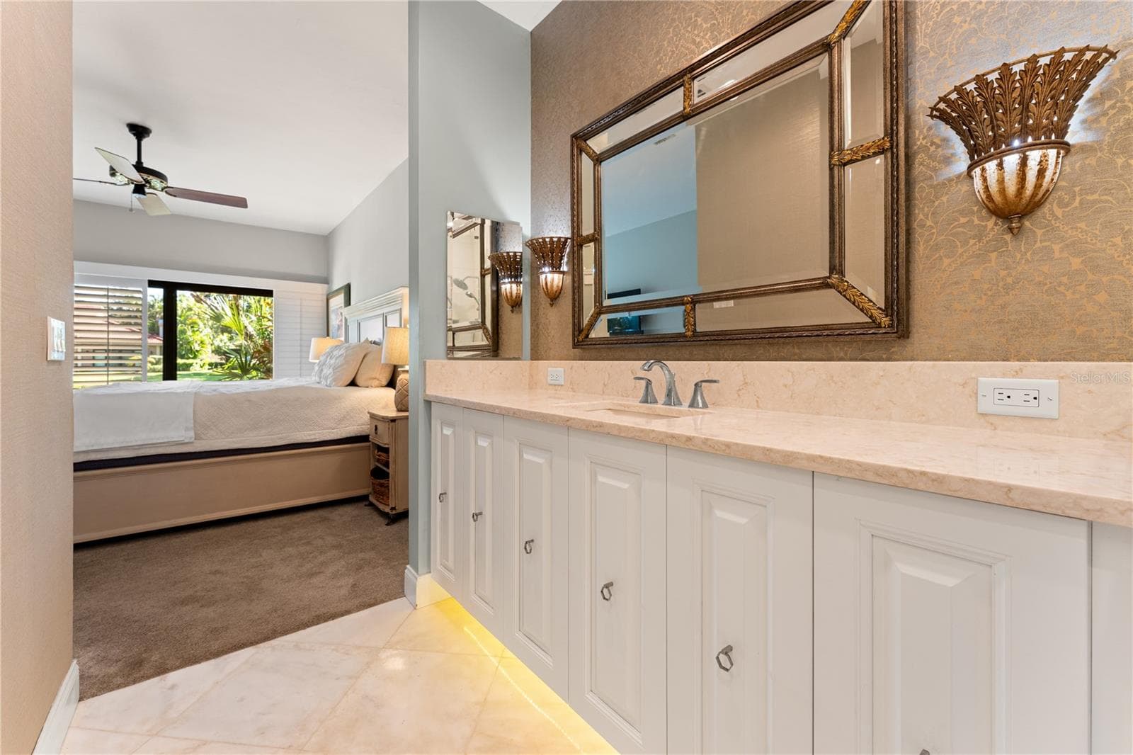 Primary ensuite bath with oversized vanity and architectural lighting. - 1720 KESTRAL PARK WAY S #49, SARASOTA