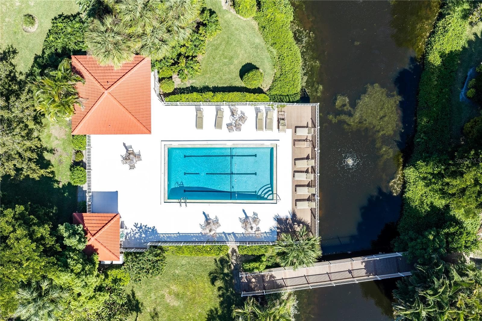 Carriagehouse Community pool and pedestrian bridge. - 1720 KESTRAL PARK WAY S #49, SARASOTA