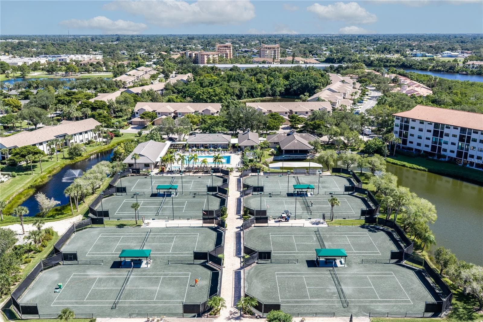 Eight Har-Tru tennis and pickleball courts at the Racquet Club. - 1720 KESTRAL PARK WAY S #49, SARASOTA