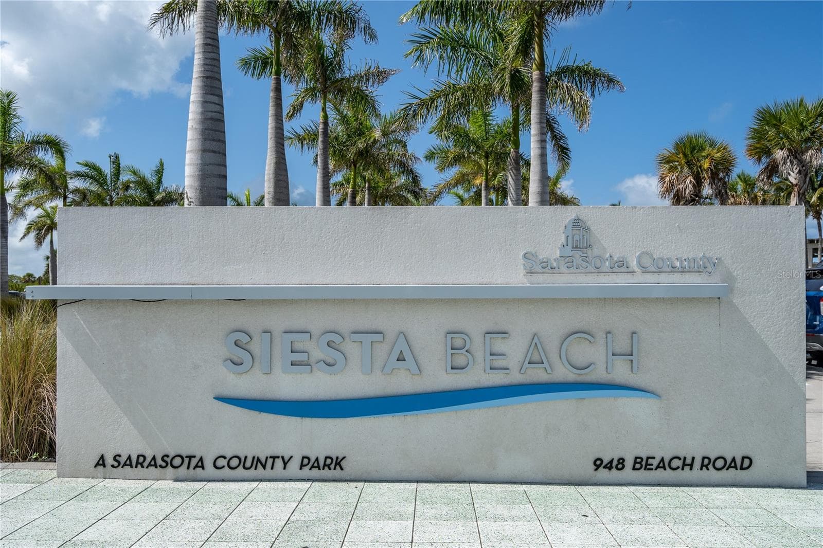 Entry sign for Siesta Key Beach, located minutes away. - 1720 KESTRAL PARK WAY S #49, SARASOTA