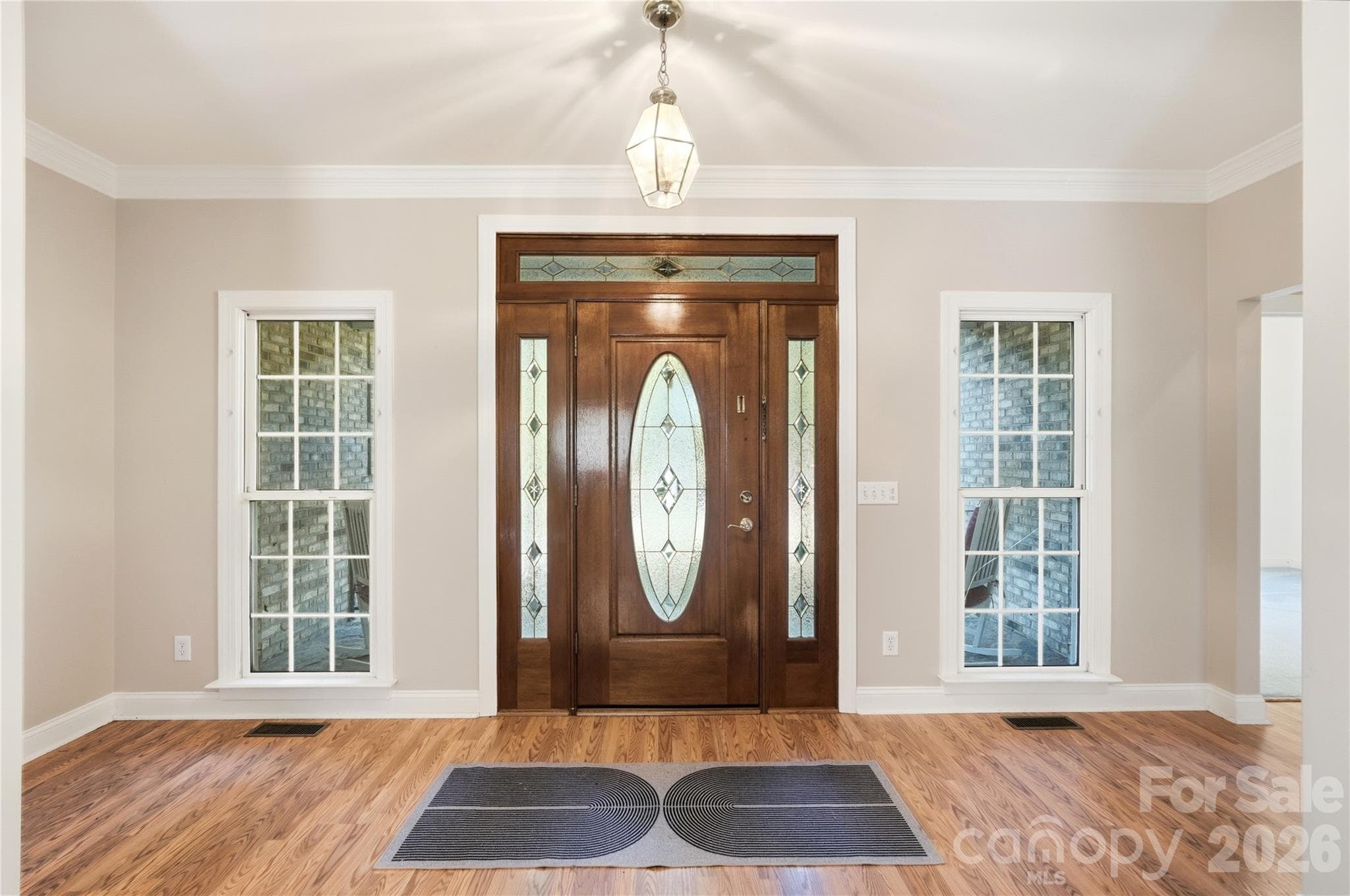 Entryway, waiting for you to greet your guests!  Open area welcoming them into the living room.  Tall ceilings, coat closet on each side of the room also ideal for storage. - 244 Ruth Boulevard, Peachland