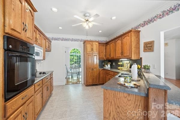 Beautiful, solid cabinetry. Double stainless steel sinks.  Work in the kitchen while joining in conversations in the living room or breakfast area. - 244 Ruth Boulevard, Peachland