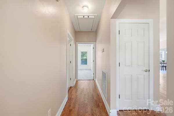 Seen here is the hallway that provides access to the guest bath and 2 secondary bedrooms in this split floor plan all brick home.  You see the coat closet close to the front door, also attic access - 244 Ruth Boulevard, Peachland