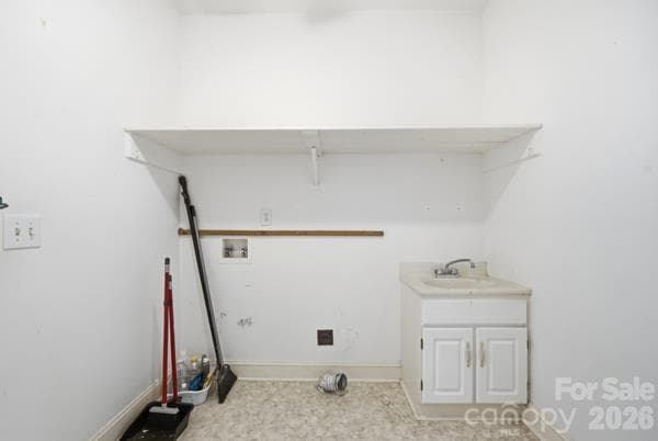 Convenient washroom with utility sink; plenty of storage.  Just off the kitchen and close to the primary bedroom. - 244 Ruth Boulevard, Peachland