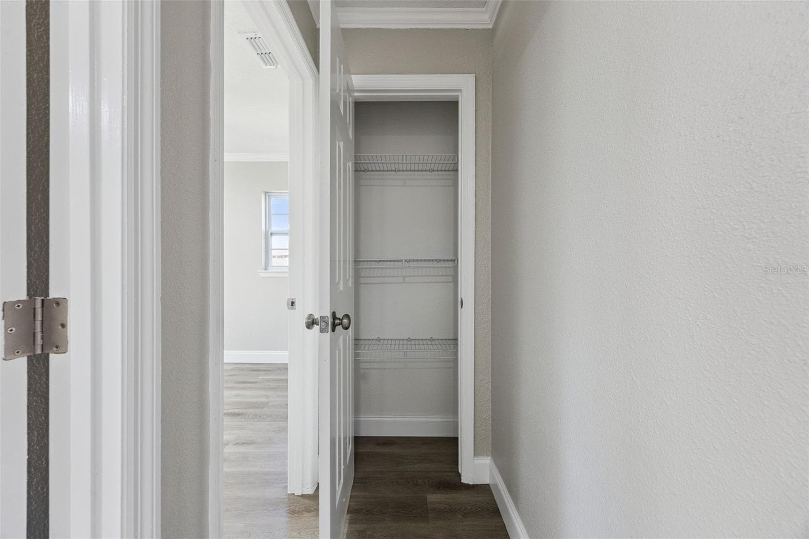 Hallway Linen Closet: Convenient central hallway storage closet equipped with built-in wire shelving - 720 GEORGIA AVE, LONGWOOD