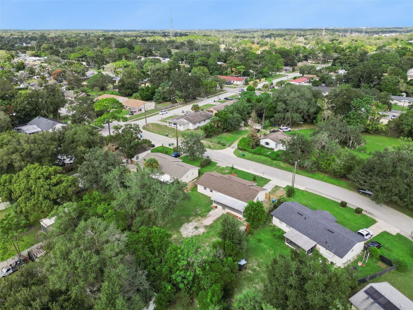 Surrounding Area Aerial: High-altitude aerial view showcasing the surrounding Longwood community landscape, nearby roads, and mature greenery - 720 GEORGIA AVE, LONGWOOD