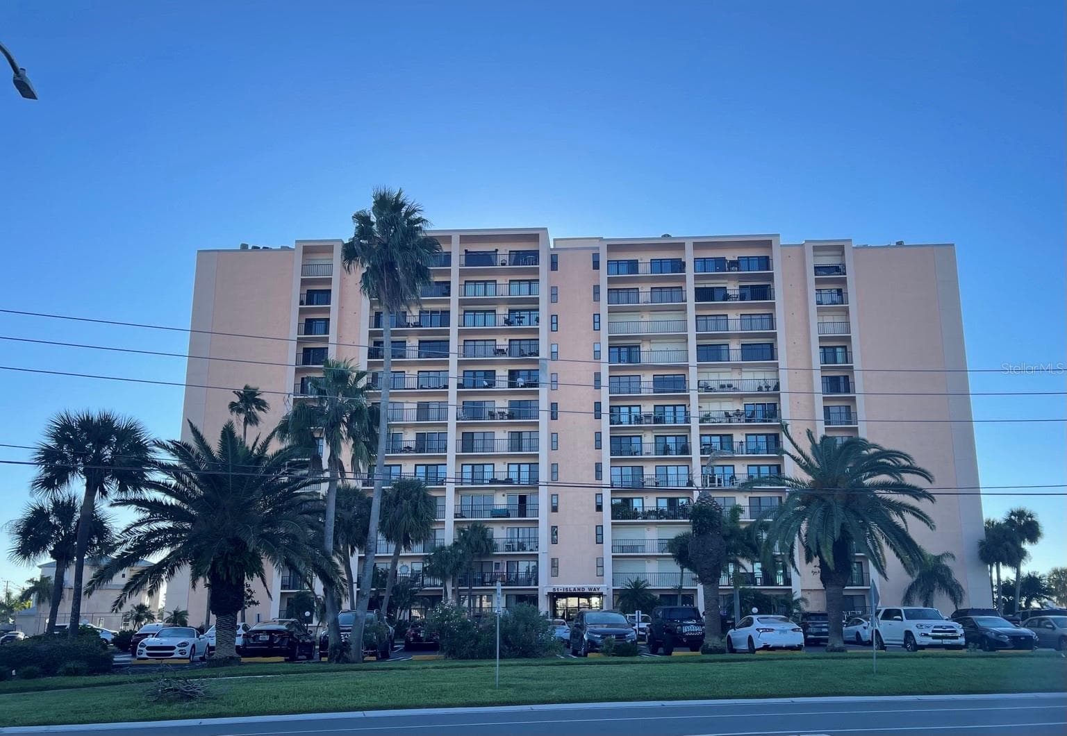 Front of building looking east - Unit is one from the top and on the right side (not the smaller patio far right) - 51 ISLAND WAY #1109, CLEARWATER