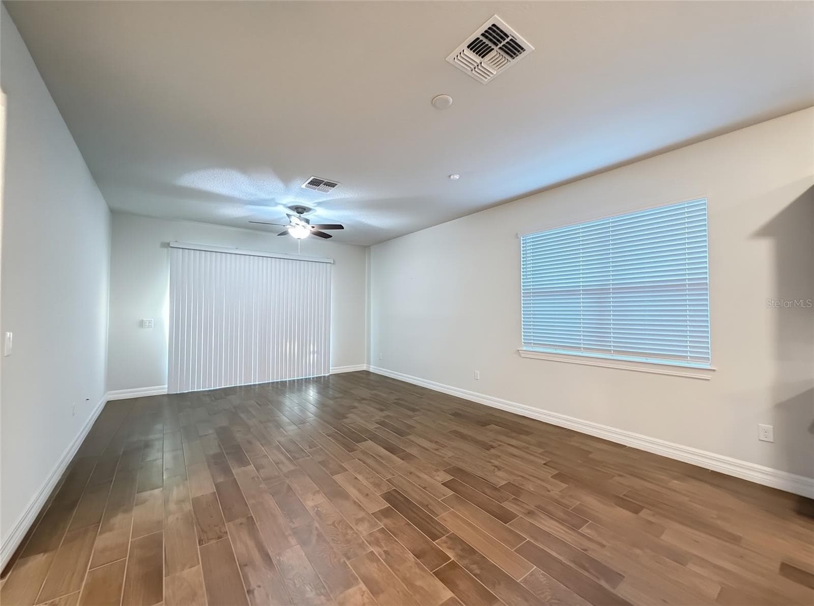 Living Room with Sliders to Screened Porch - 19420 SHIP WHEEL WAY, LAND O LAKES