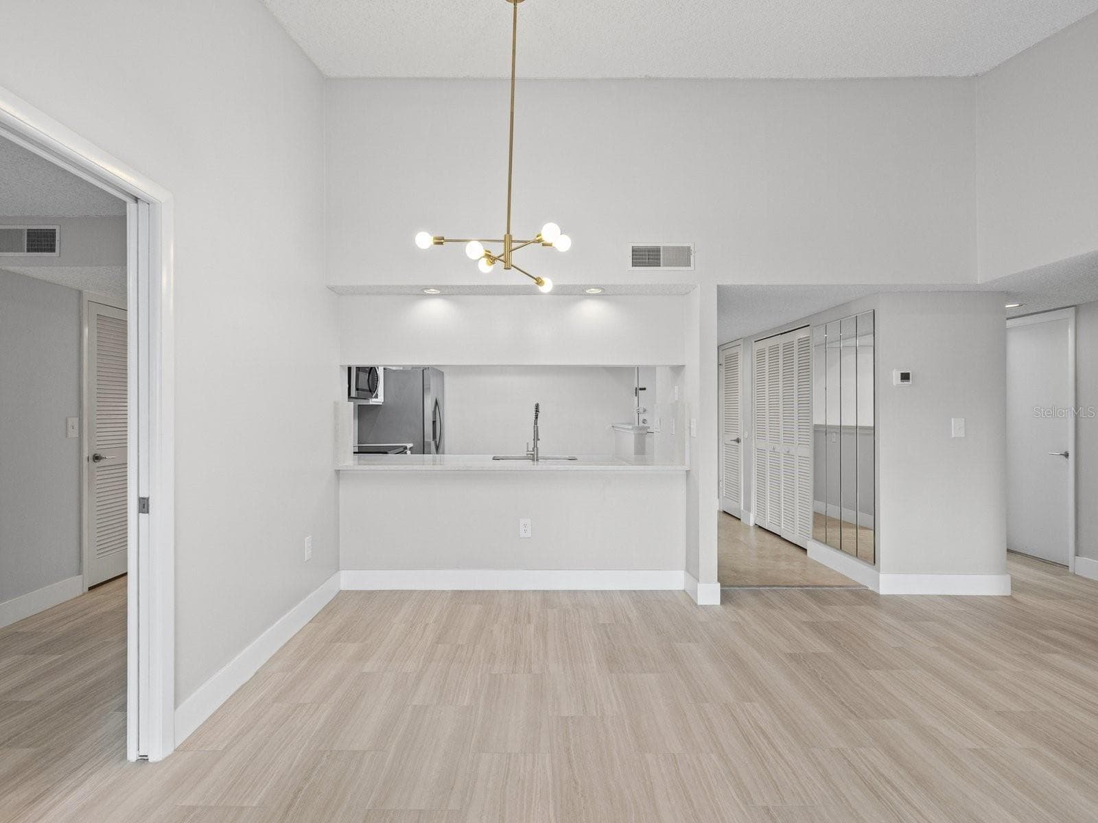 Dining area new modern lighting - 2593 COUNTRYSIDE BLVD #7304, CLEARWATER