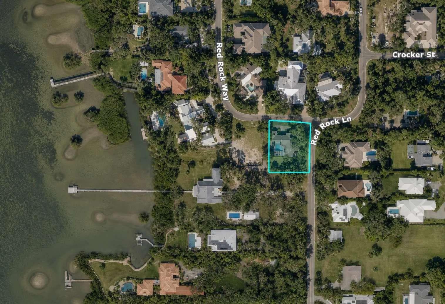 Aerial location image. Approximate parcel outline for orientation only; not a survey or verified boundary. - 3970 RED ROCK LN, SARASOTA