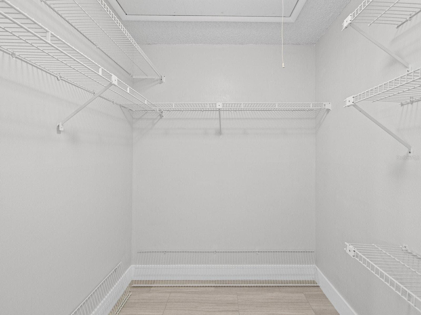 Large walk in closet with pull down stairs to storage above - 2593 COUNTRYSIDE BLVD #7304, CLEARWATER