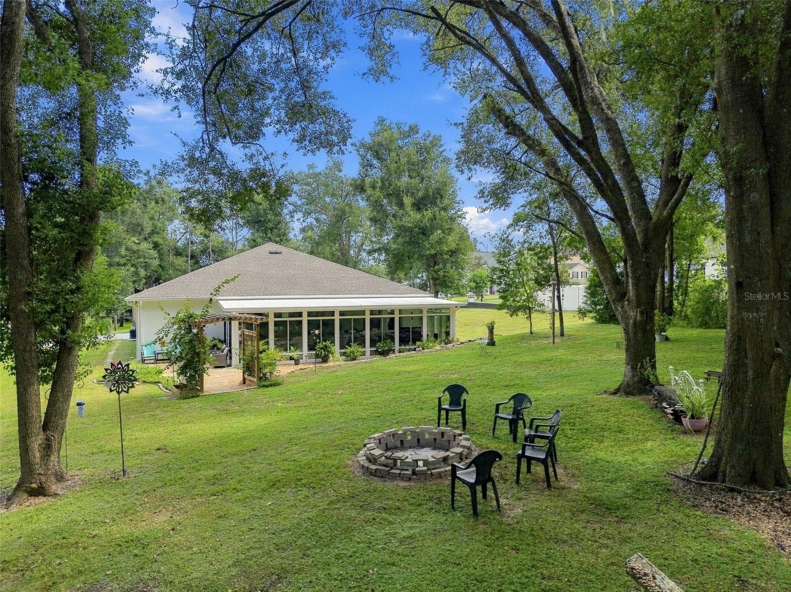 Fire Pit in Clearing - 9909 PINE LEAF LN, DADE CITY