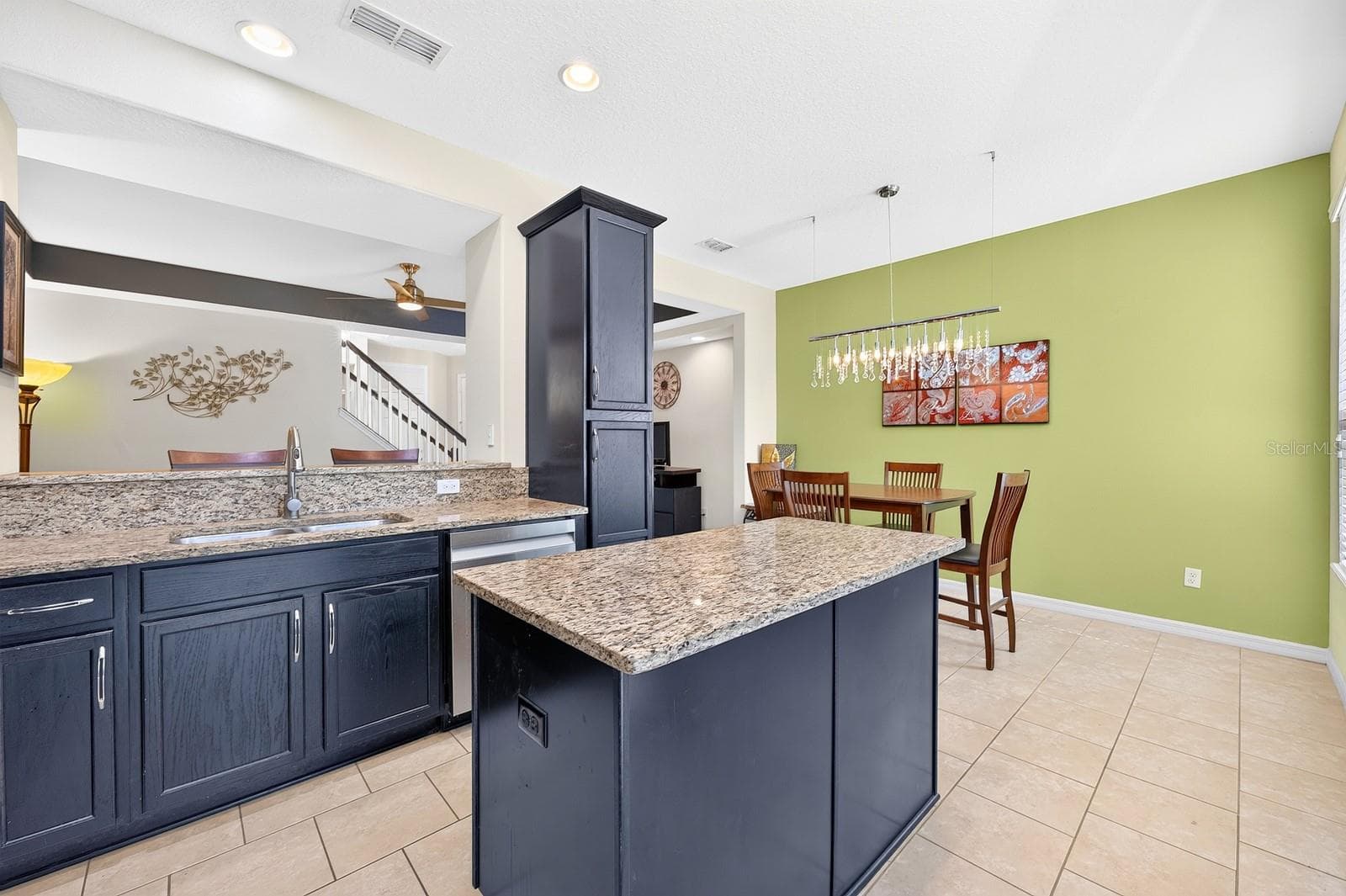 A center island in the Kitchen provides extra prep space. - 2109 VICTORIA GLEN DR, SANFORD