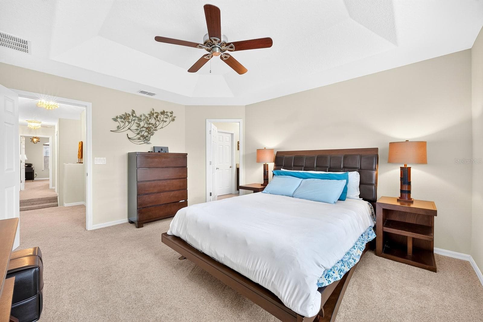 Upstairs, the spacious Primary Bedroom offers a TRAY CEILING, plush carpet and a private EN SUITE BATH. - 2109 VICTORIA GLEN DR, SANFORD