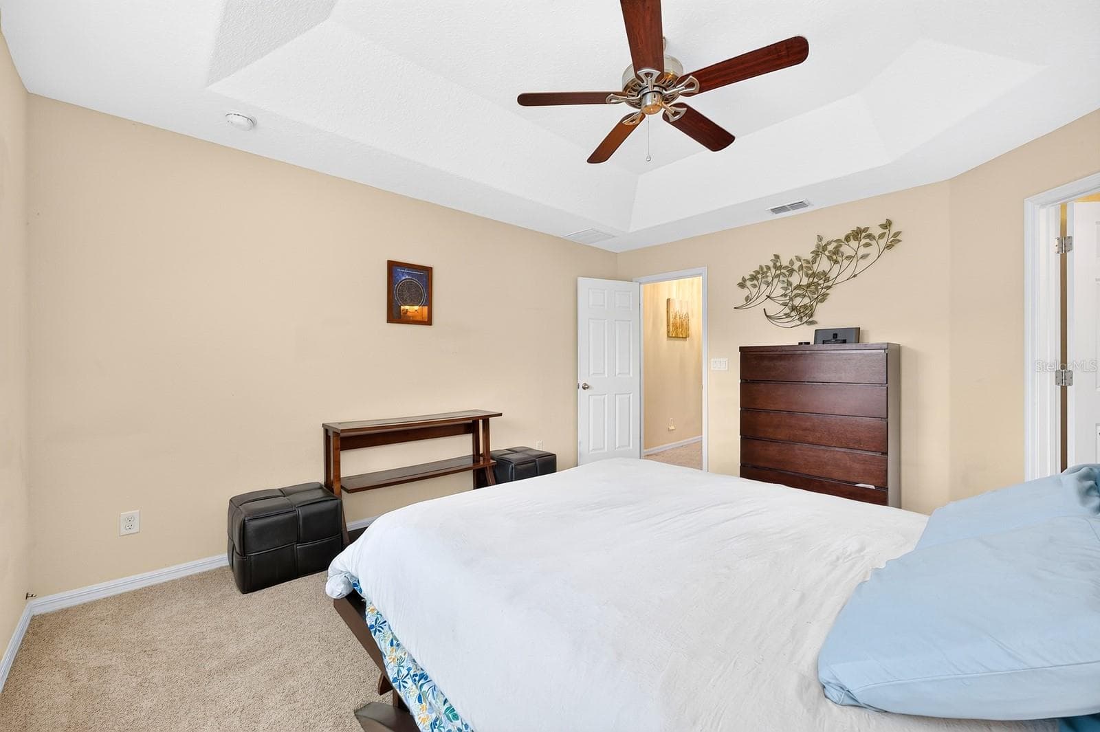 Upstairs, the spacious Primary Bedroom offers a TRAY CEILING, plush carpet and a private EN SUITE BATH. - 2109 VICTORIA GLEN DR, SANFORD