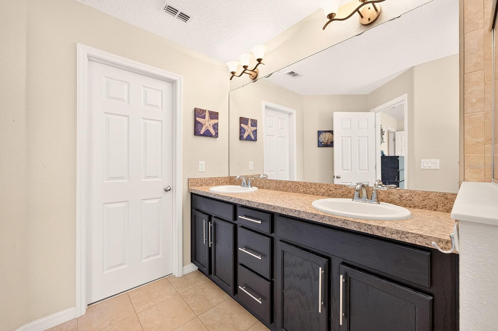 The well-appointed Bath features DUAL SINKS, a relaxing GARDEN TUB, a separate STEP-IN SHOWER and a HUGE WALK-IN CLOSET. - 2109 VICTORIA GLEN DR, SANFORD