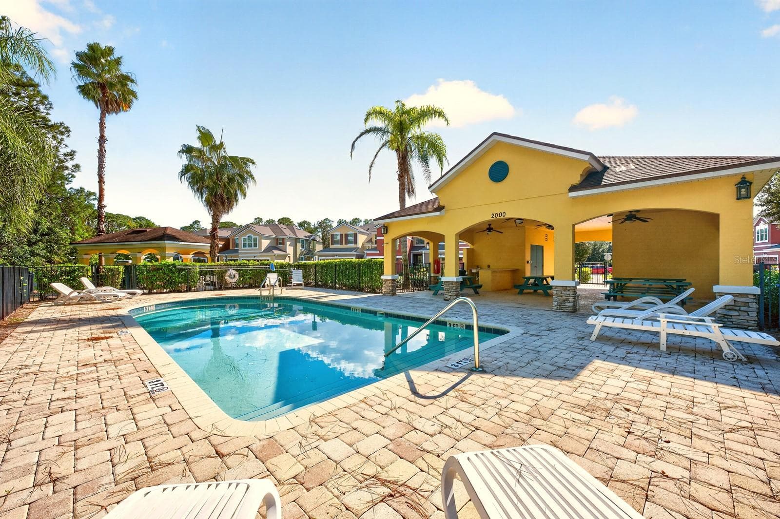 The SPARKLING COMMUNITY POOL, located close to the home—makes it easy to enjoy a refreshing swim without the work of maintaining a pool yourself. - 2109 VICTORIA GLEN DR, SANFORD