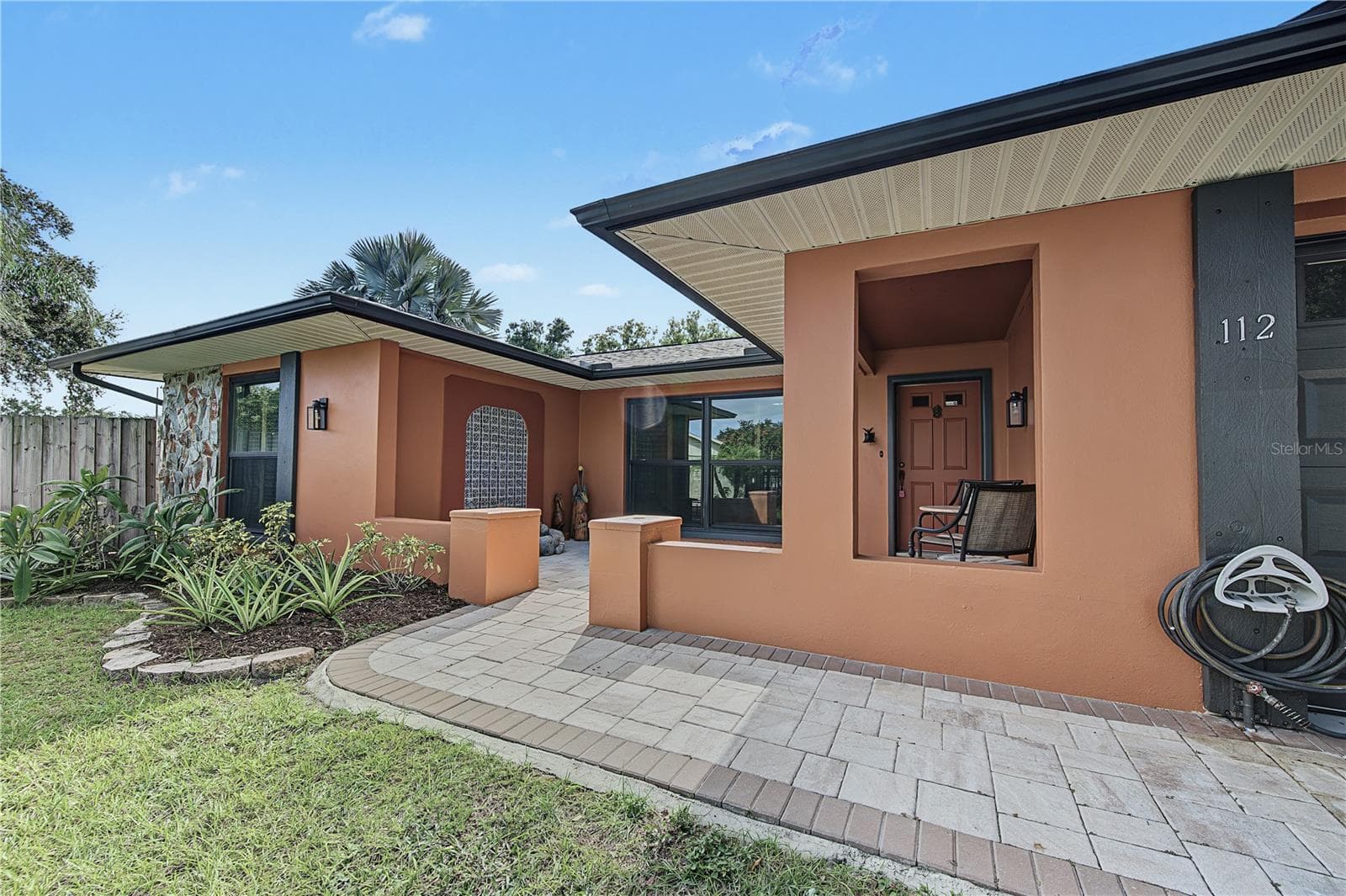 6. Pavers Laid Into Courtyard Entry to Create a QQuaint Front Patio for Outdoor Living! - 112 PEACOCK CIR, SAFETY HARBOR