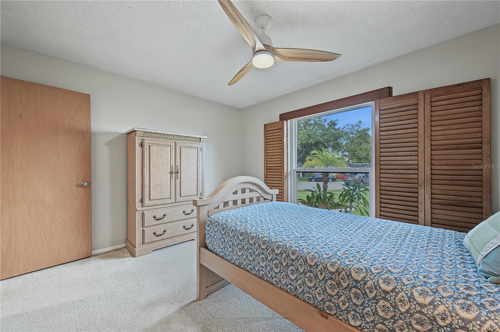 28. Bedrm #3 (11 x 12.9') Features Wood Shutters that Open Out to the Wall if Desired, or Adjust the Slats.. - 112 PEACOCK CIR, SAFETY HARBOR