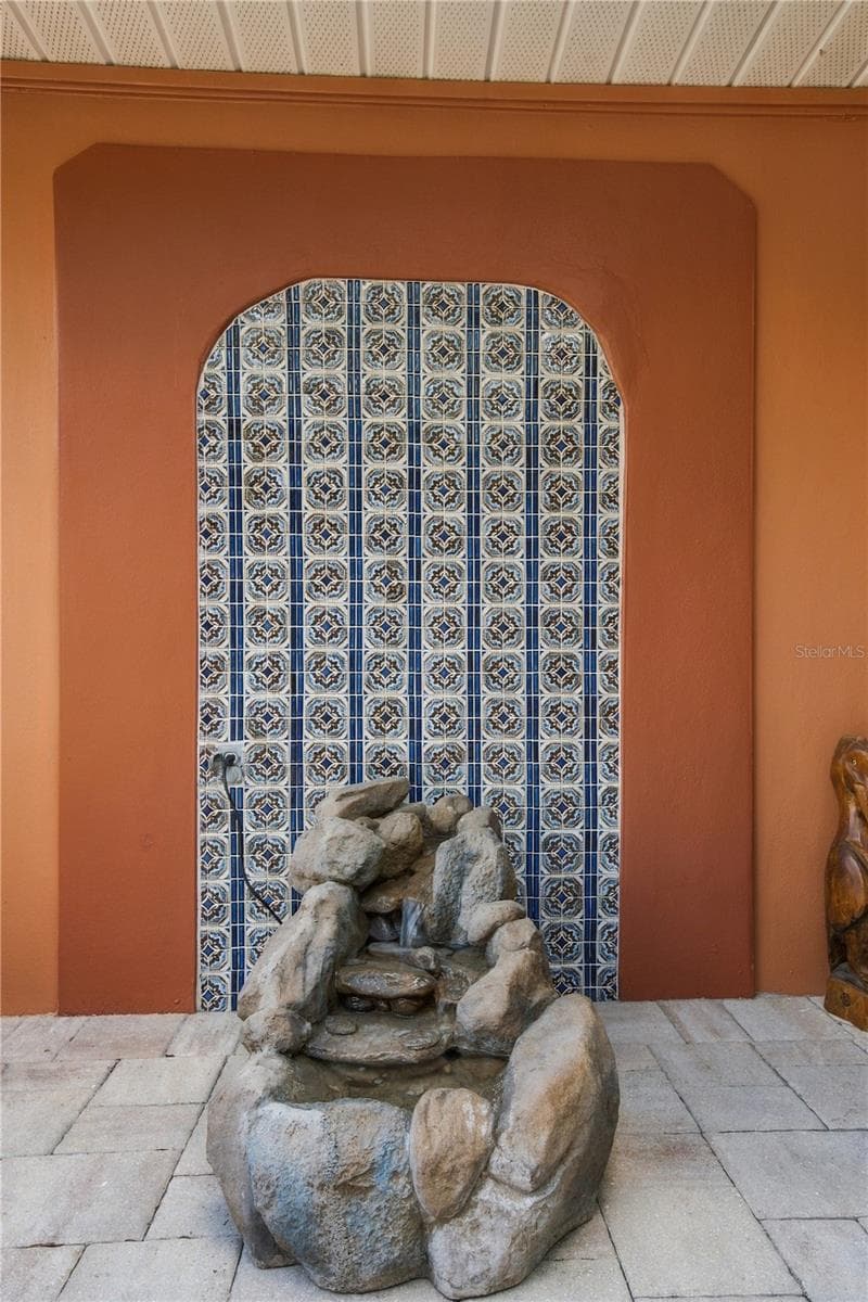 41b. Arch Tile Detail Adds an Exotic Elegance to the Courtyard Entry... The Trickling Fountain is the Cherry on Top! - 112 PEACOCK CIR, SAFETY HARBOR