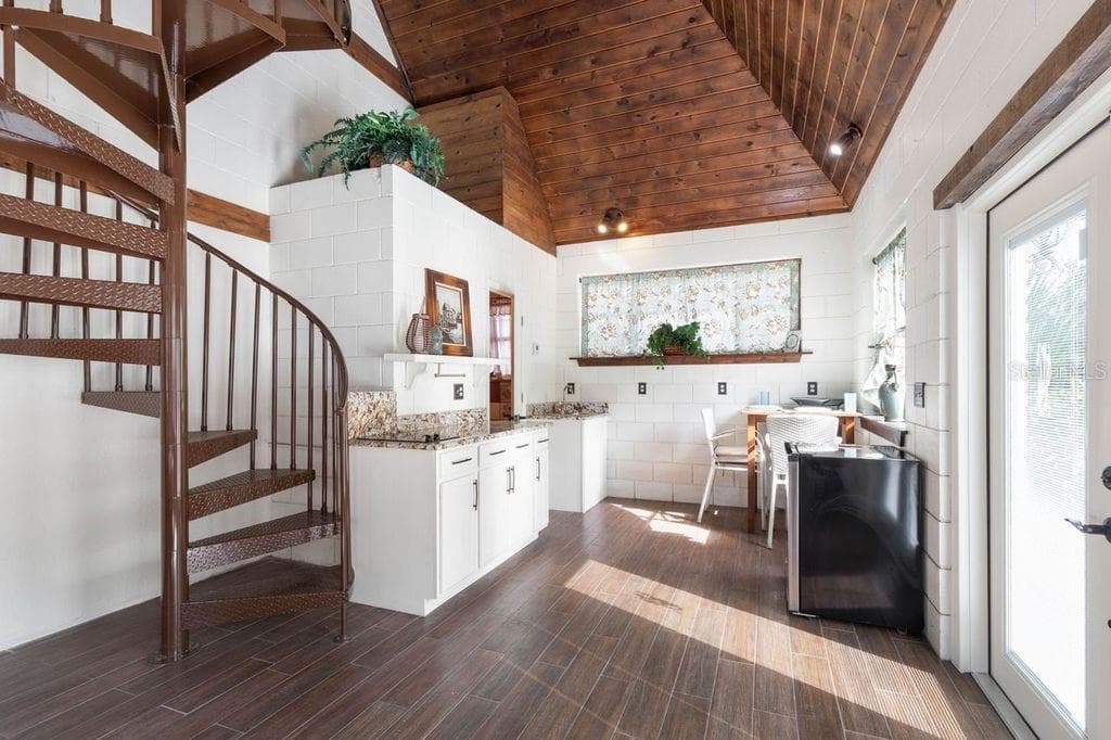 circular staircase to upper bed and bath - 2627 JOHN ANDERSON DR, ORMOND BEACH
