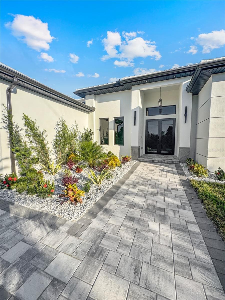 Front Entrance with Paver Walkway and Landscaping - 8568 SANTA CRUZ DR, PORT CHARLOTTE