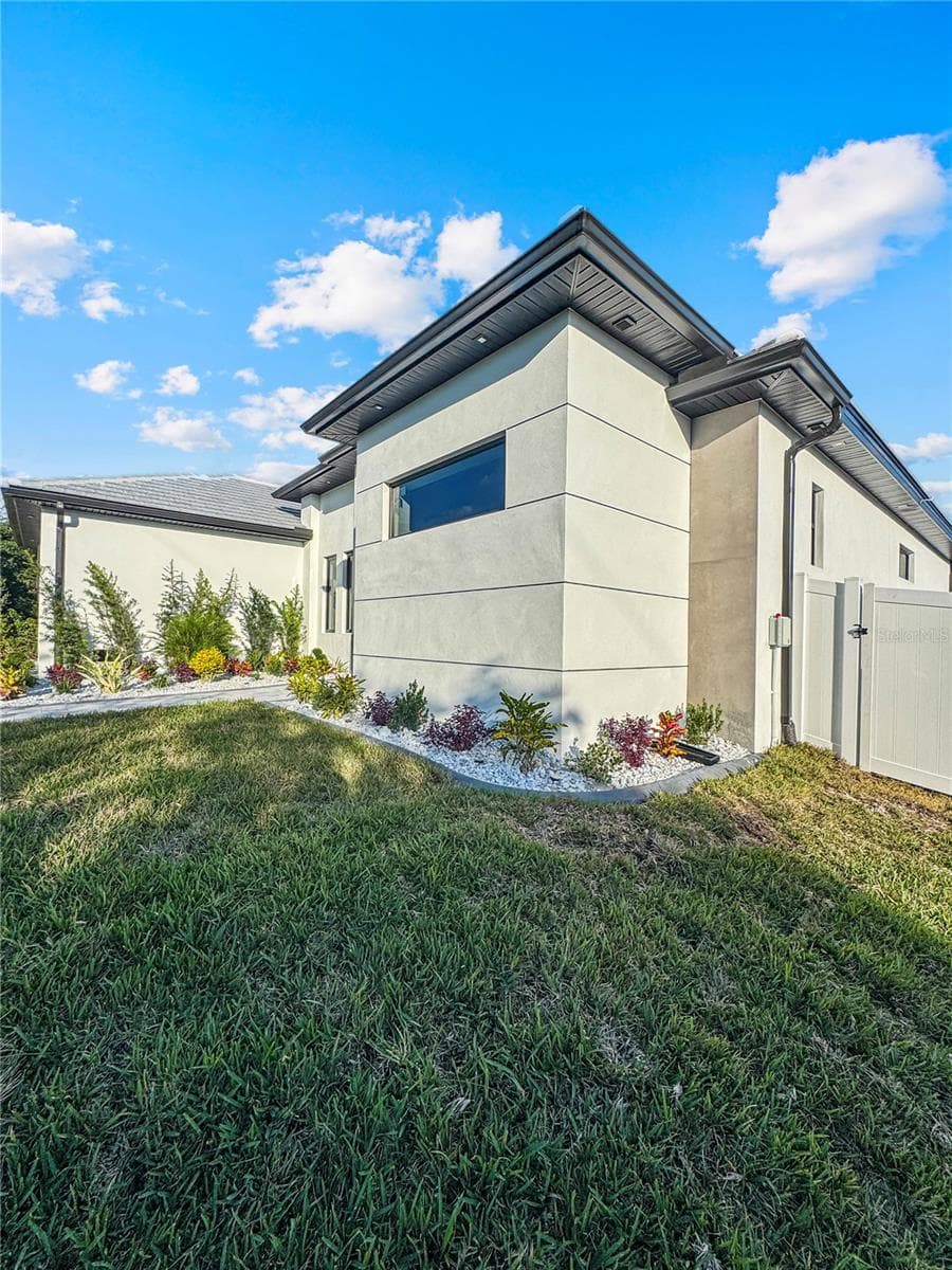 Side Exterior View of Home - 8568 SANTA CRUZ DR, PORT CHARLOTTE