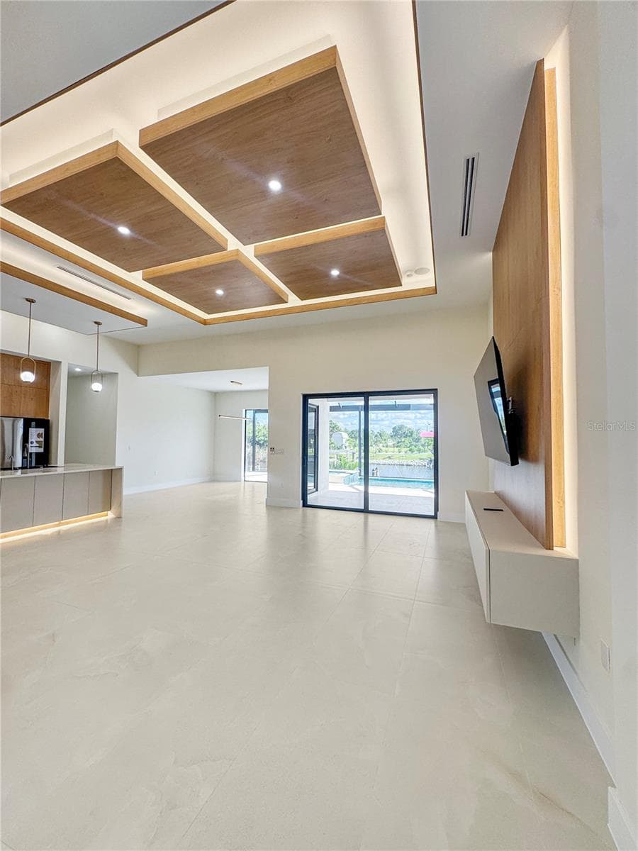 Open-Concept Living Area with Custom Ceiling - 8568 SANTA CRUZ DR, PORT CHARLOTTE