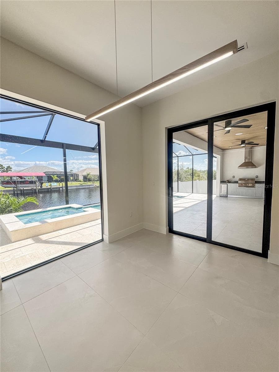 Dining Area with Sliding Glass Doors to Lanai - 8568 SANTA CRUZ DR, PORT CHARLOTTE