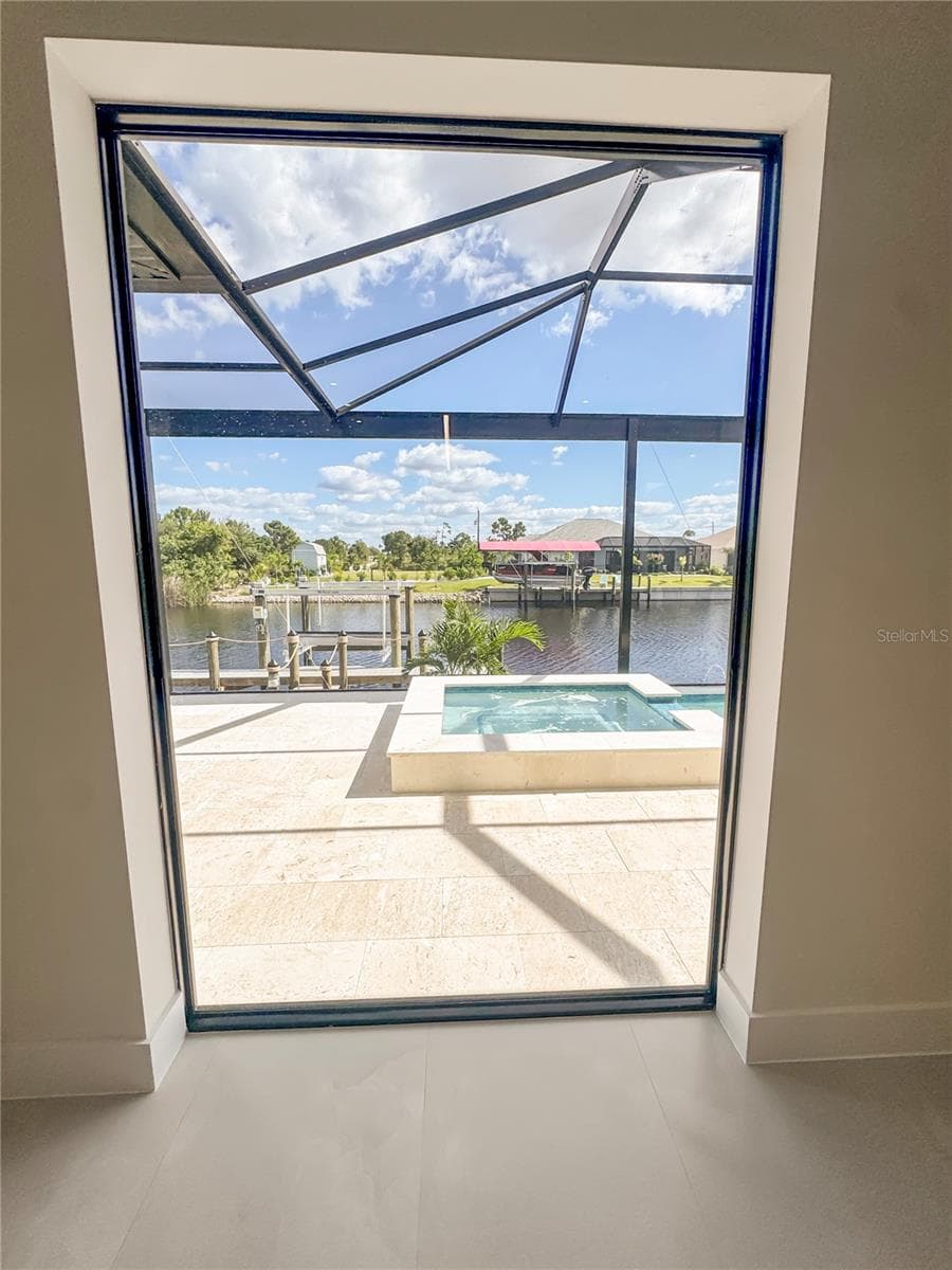 View from Dining Area Through Fixed Glass - 8568 SANTA CRUZ DR, PORT CHARLOTTE