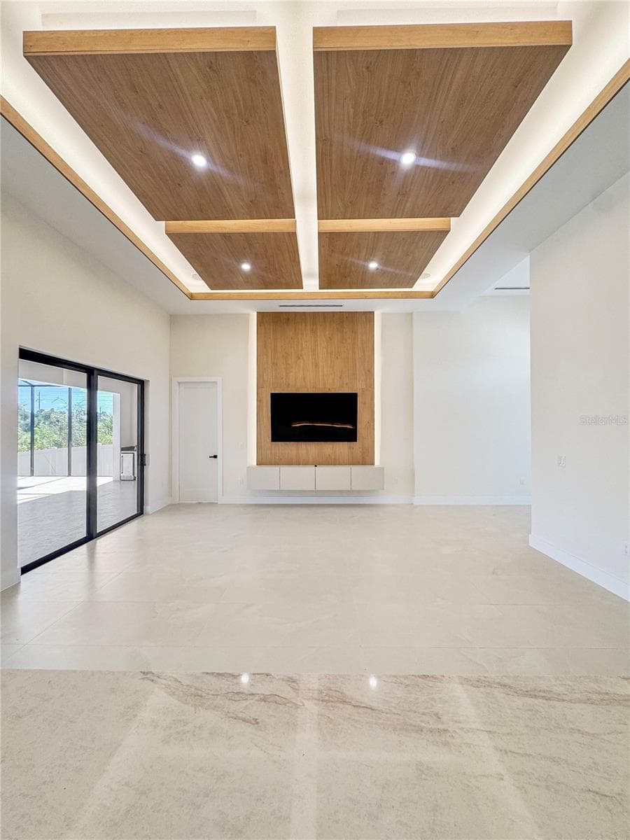 Living Room with Custom Ceiling and TV Feature Wall - 8568 SANTA CRUZ DR, PORT CHARLOTTE