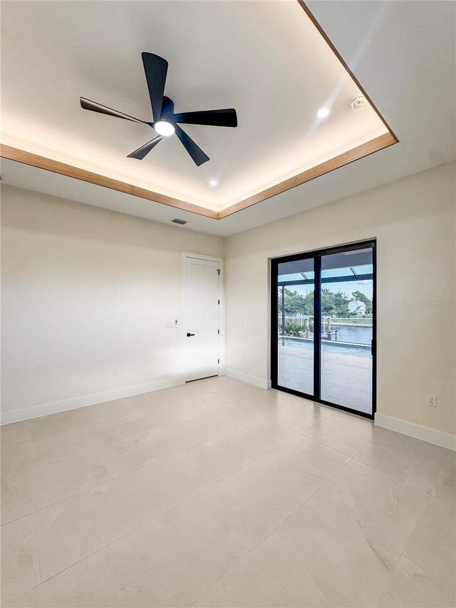 Master Bedroom with Custom Ceiling and Sliding Glass Doors - 8568 SANTA CRUZ DR, PORT CHARLOTTE