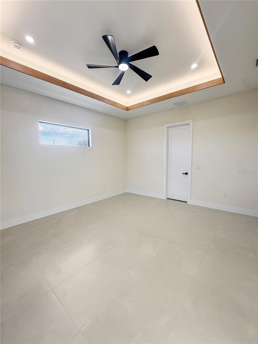 Master Bedroom with Custom Ceiling and Porcelain Tile Flooring - 8568 SANTA CRUZ DR, PORT CHARLOTTE